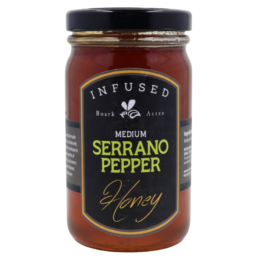 Jar of Infused Medium Serrano Pepper Honey with a black label on a white background